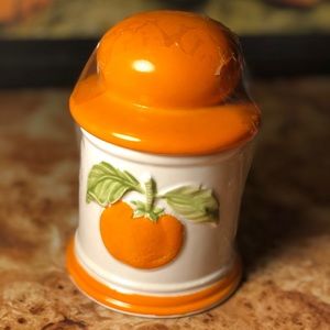 Orange dish with little scoop